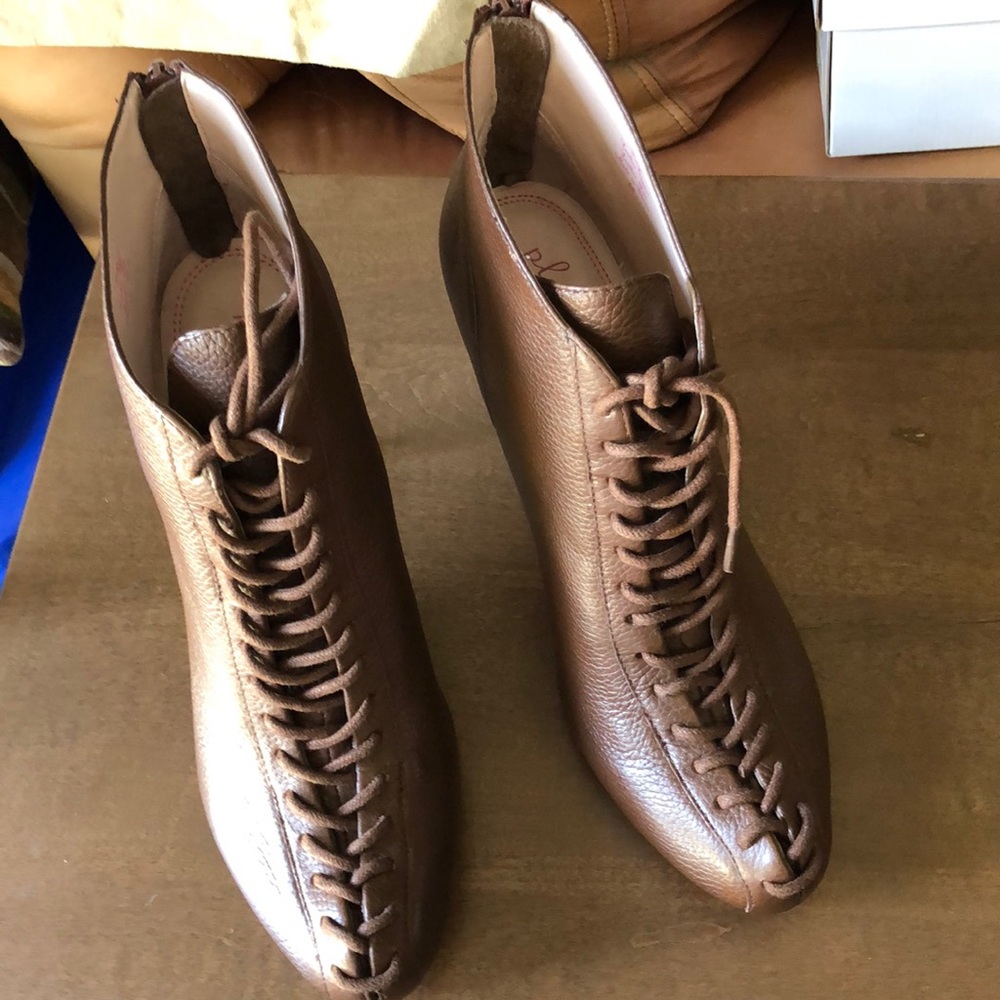 Laced up zipper heeled booties